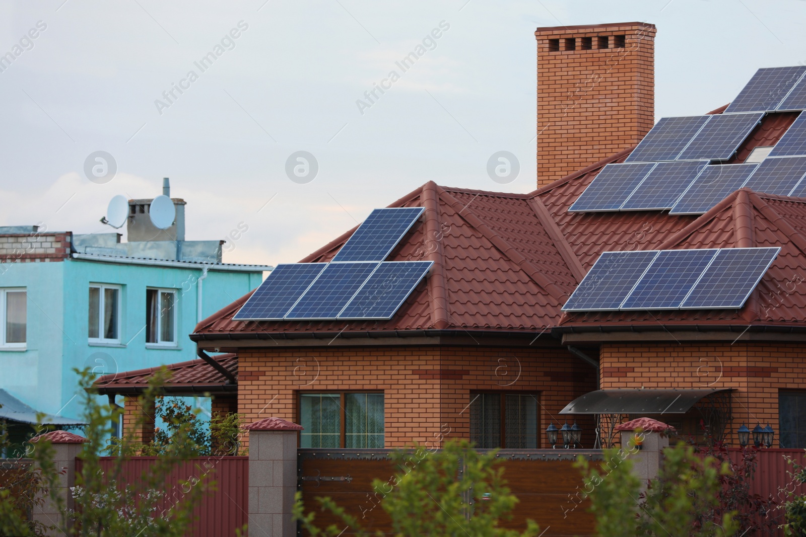 Photo of House with installed solar panels on roof