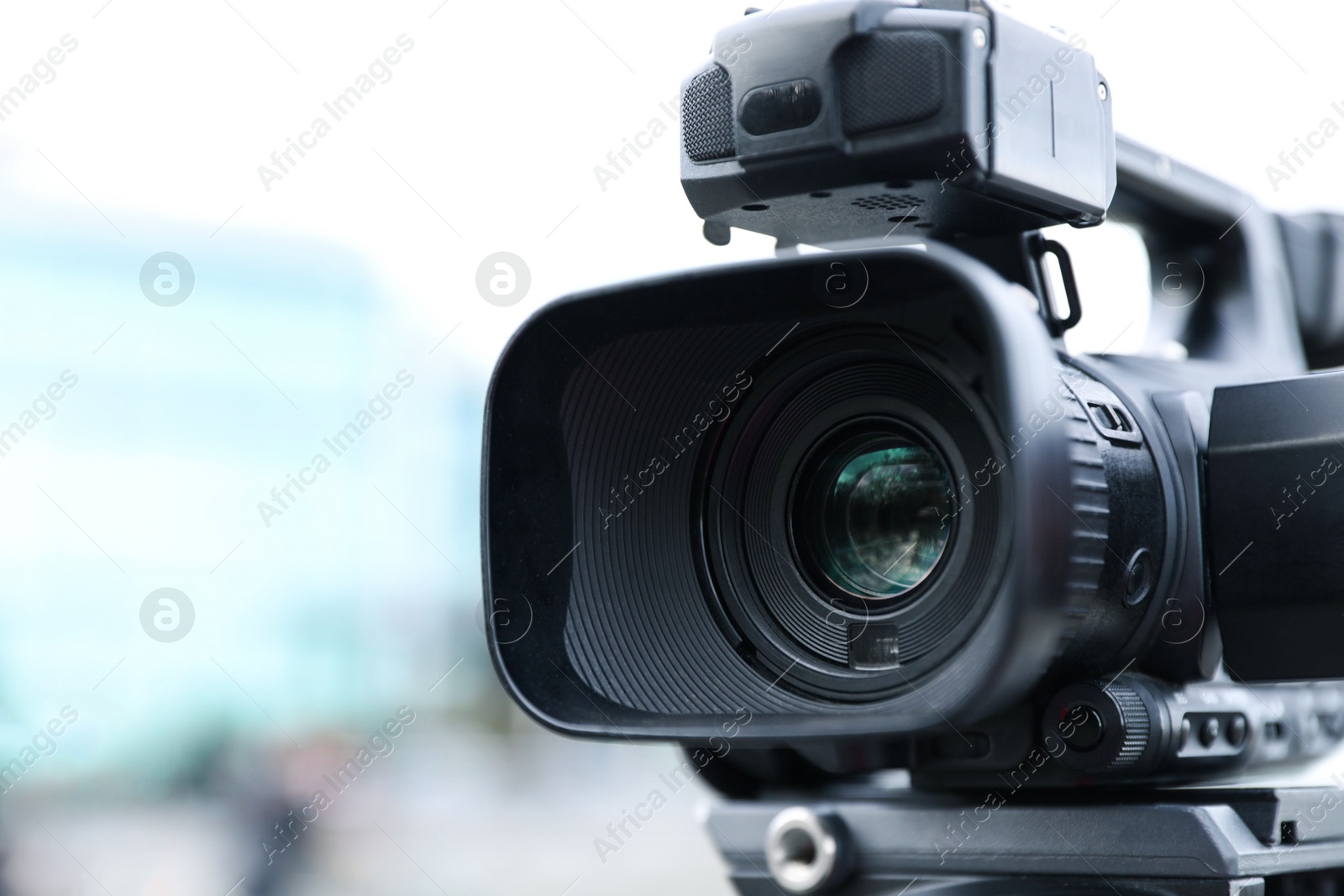 Photo of Professional video camera on city street, closeup