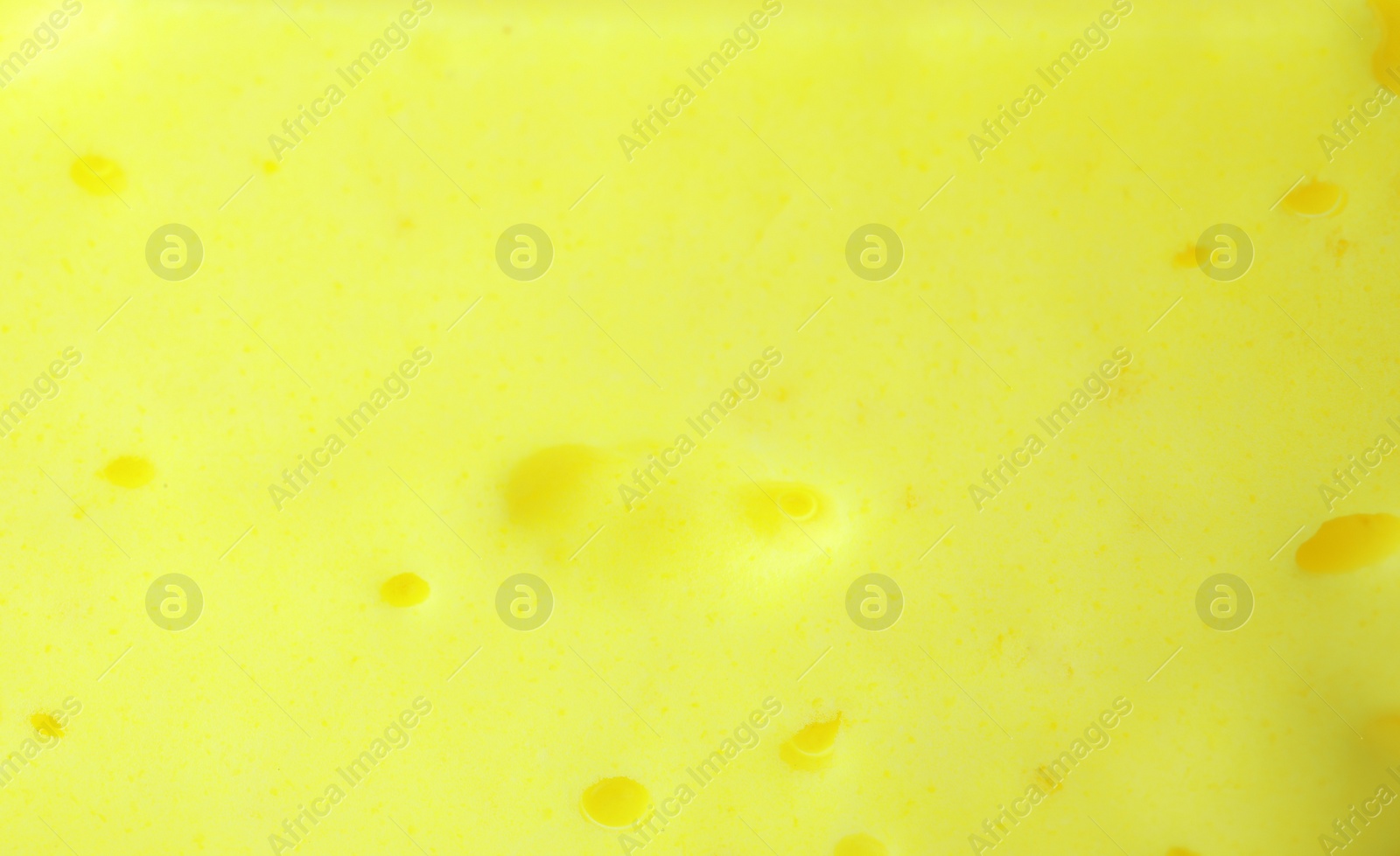 Photo of Closeup view of yellow slime. Antistress toy