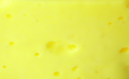 Photo of Closeup view of yellow slime. Antistress toy