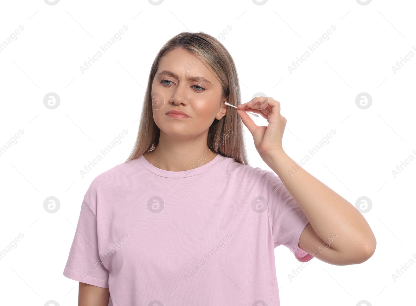 Photo of Young woman cleaning ear with cotton swab on white background