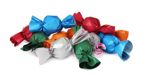 Photo of Many candies in colorful wrappers on white background