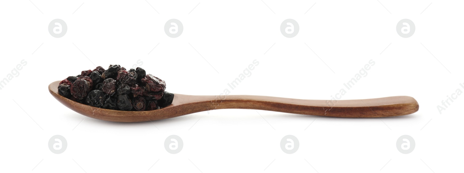 Photo of Dried black currants in wooden spoon isolated on white
