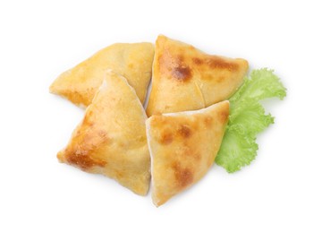 Photo of Delicious samosas and lettuce isolated on white, top view