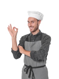 Photo of Professional chef wearing uniform on white background