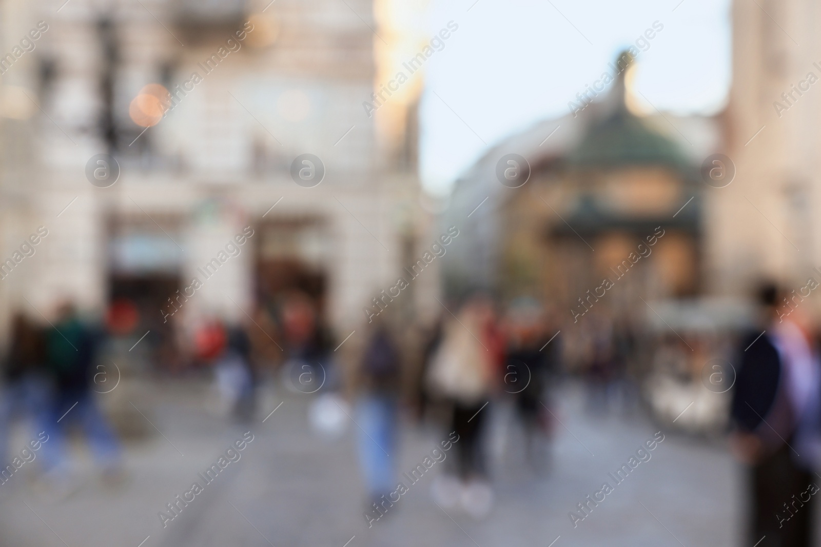 Photo of Blurred view of people walking on city street