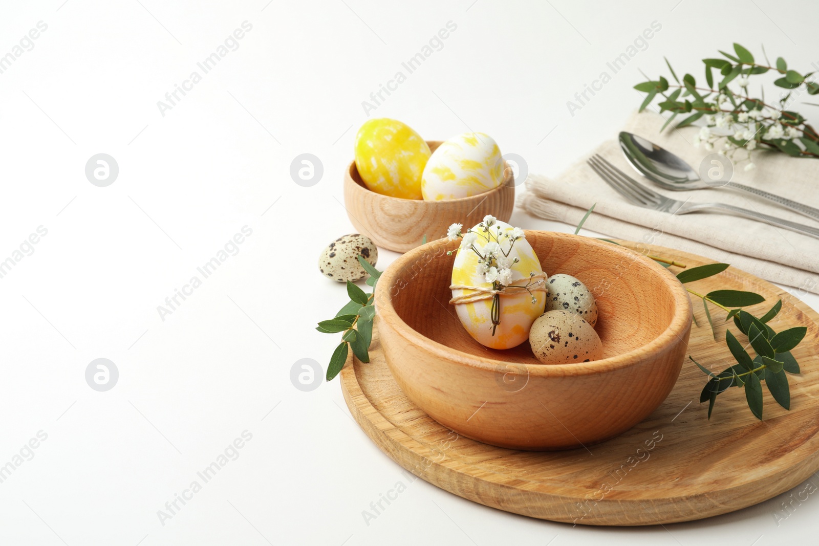 Photo of Festive Easter table setting with eucalyptus and eggs. Space for text