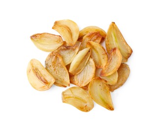 Photo of Pile of fried garlic cloves isolated on white, top view