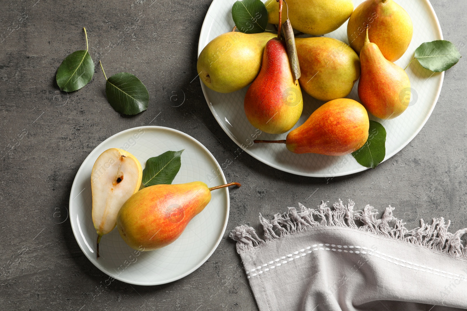 Photo of Flat lay composition with ripe pears on grey background