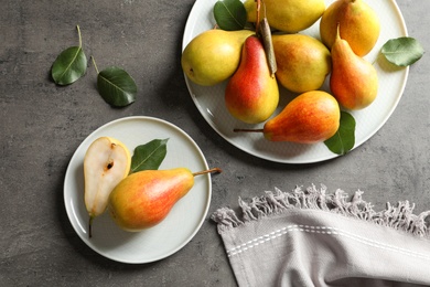 Photo of Flat lay composition with ripe pears on grey background