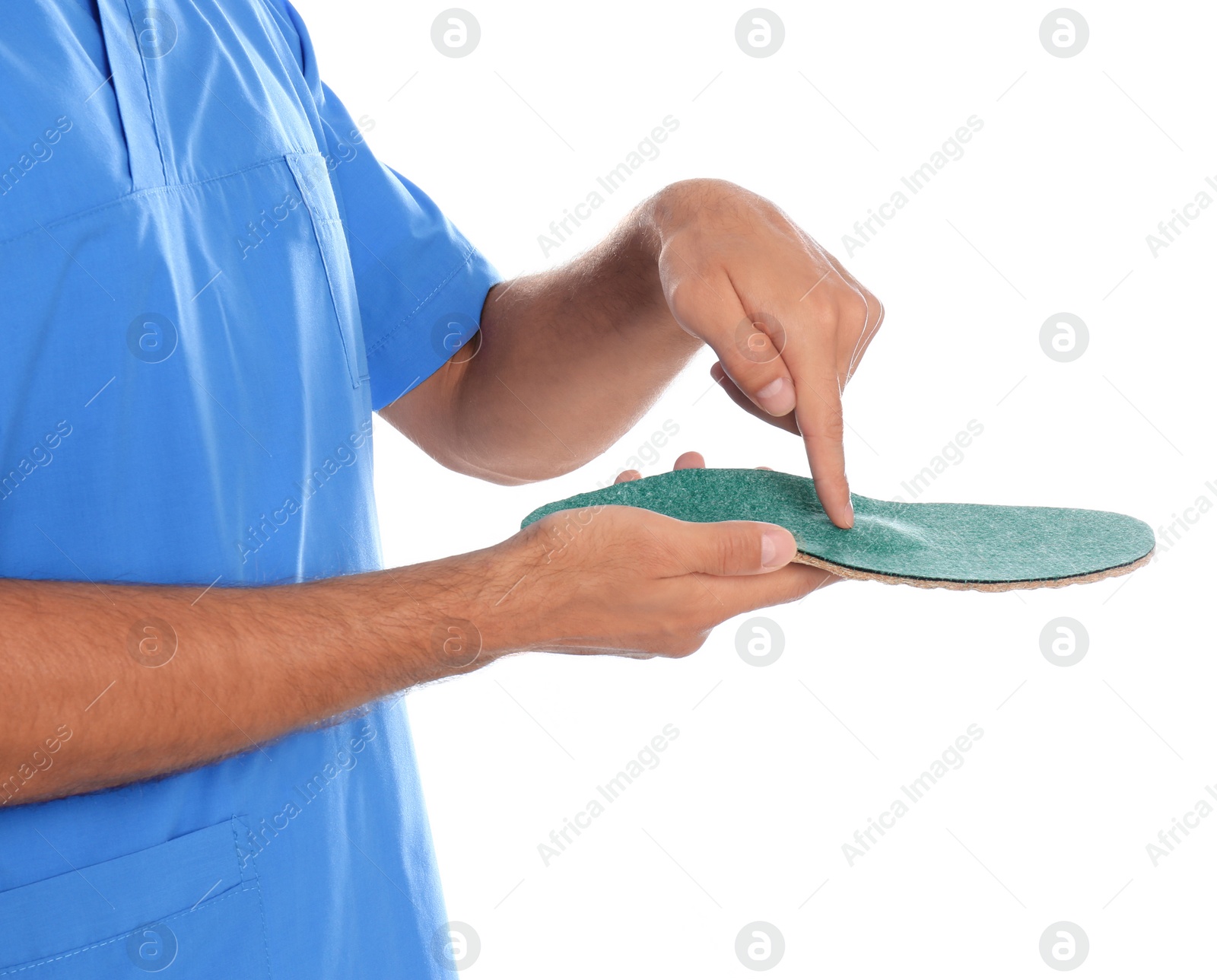 Photo of Male orthopedist showing insole on white background, closeup