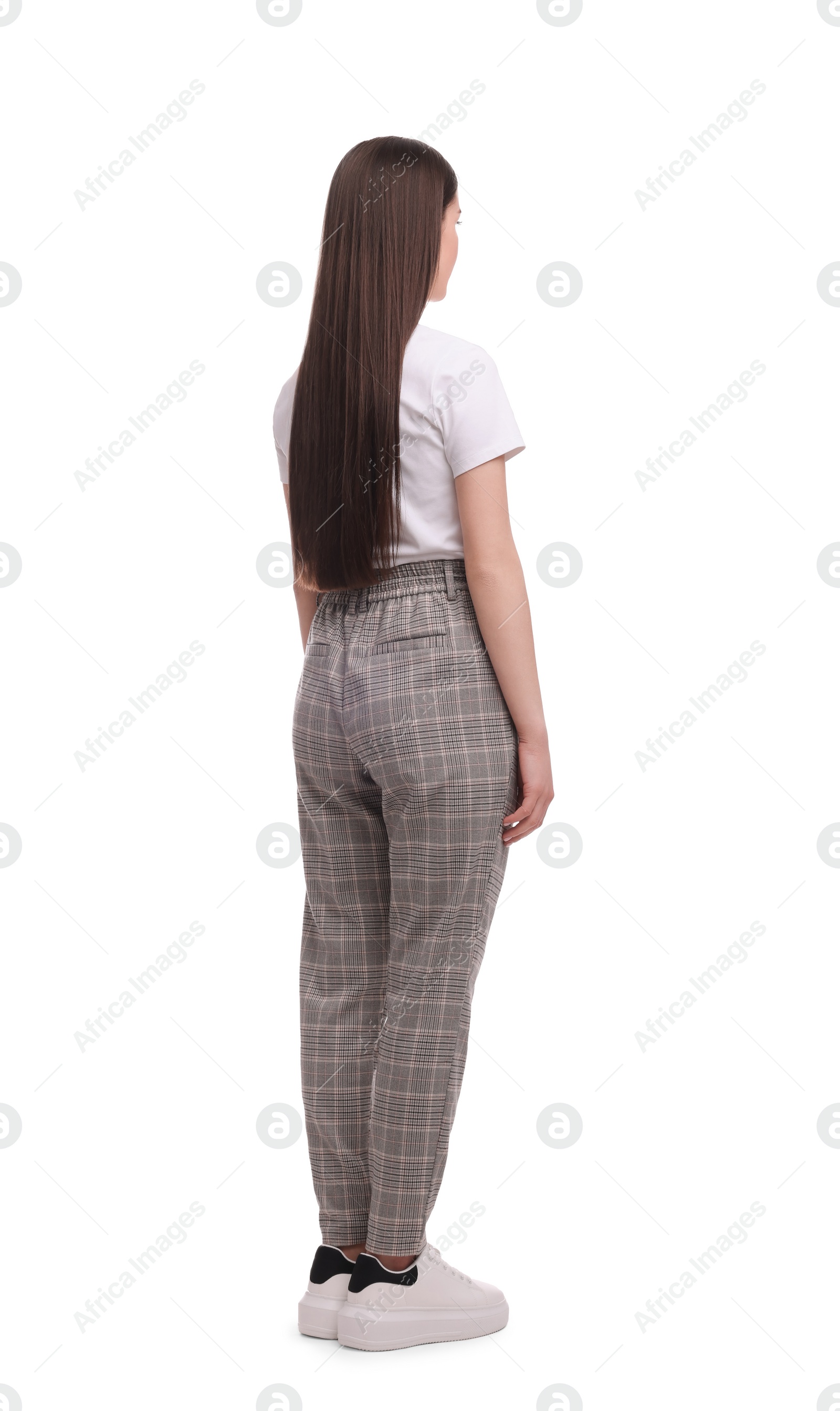 Photo of Businesswoman standing on white background, back view