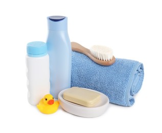 Baby cosmetic products, bath duck, brush and towel isolated on white