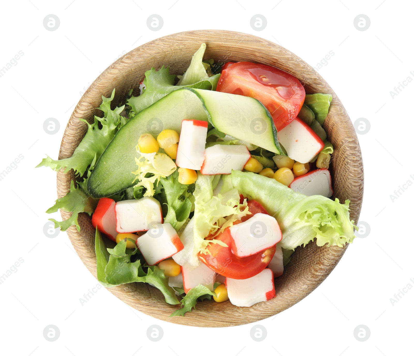 Photo of Delicious salad with crab sticks and lettuce in wooden bowl on white background, top view