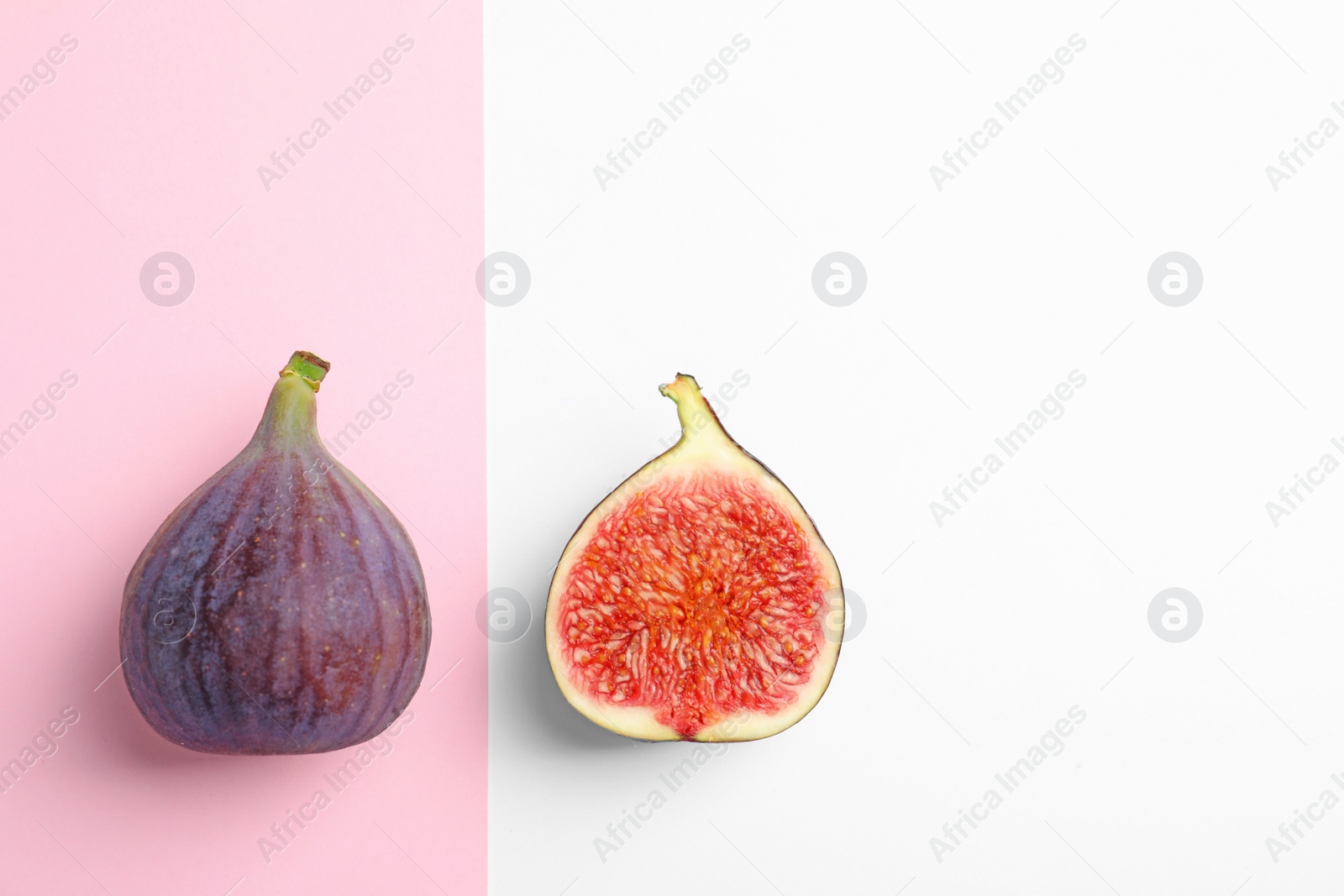 Photo of Fresh ripe figs on color background, top view. Space for text