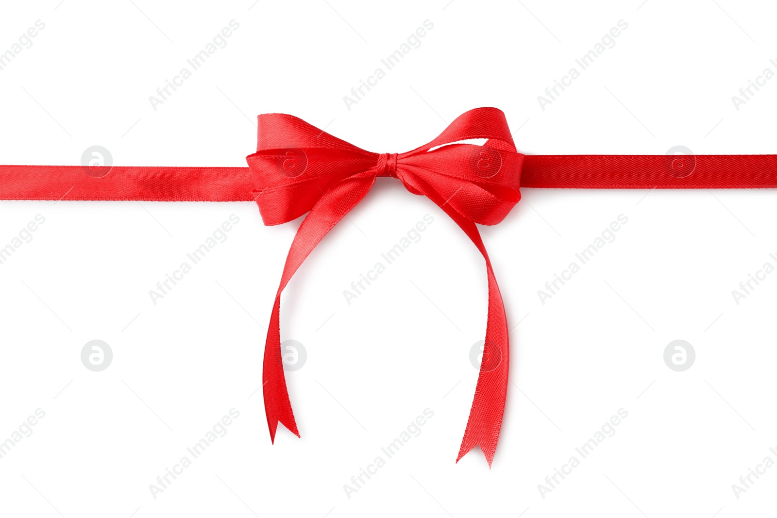 Photo of Red bow and ribbon on white background, top view