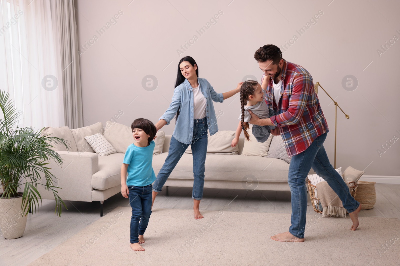 Photo of Happy family spending time together at home