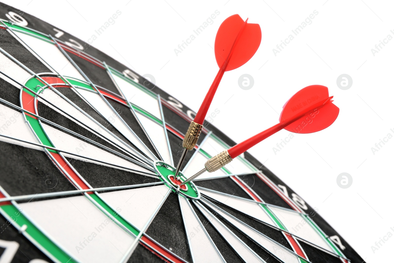 Photo of Dart board with color arrows hitting target, closeup