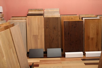 Many different samples of wooden flooring in store