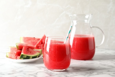 Photo of Tasty summer watermelon drink served on table