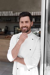 Portrait of professional baker in bakery shop