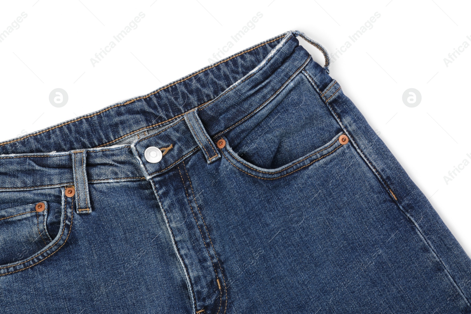 Photo of Stylish dark blue jeans isolated on white, top view