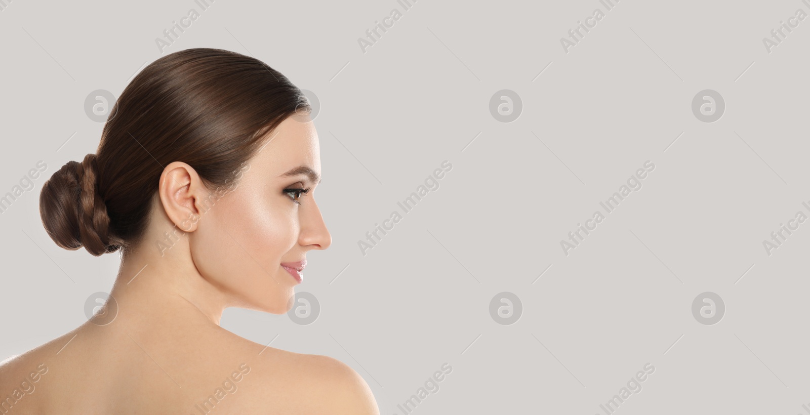 Image of Young woman with beautiful face on light background, space for text. Banner design