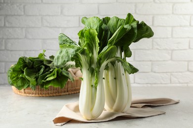 Fresh green pak choy cabbages on light table