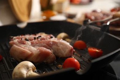 Photo of Frying pan with fresh raw meat and vegetables, closeup