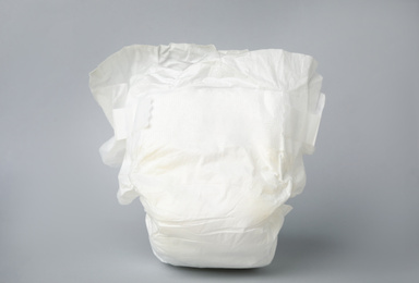 Photo of Baby diaper on light grey background, closeup. Child's underwear