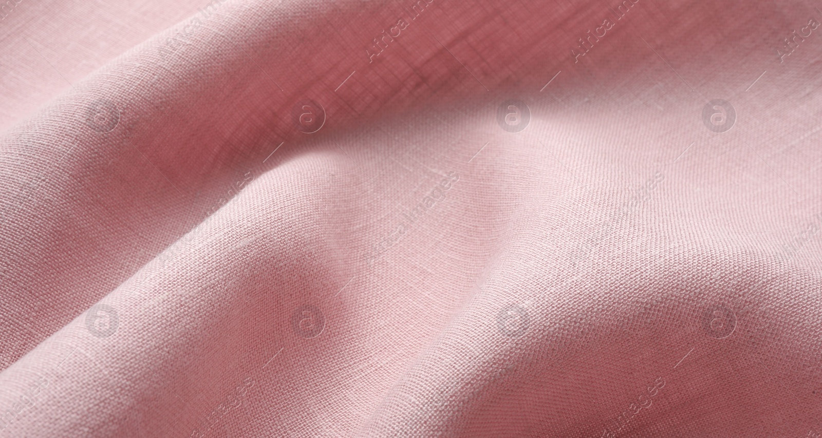 Photo of Texture of pink crumpled fabric as background, closeup