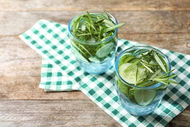 Natural lemonade with cucumber in glasses on table