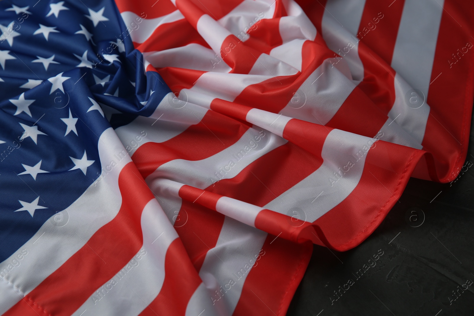 Photo of Flag of USA on black table, closeup