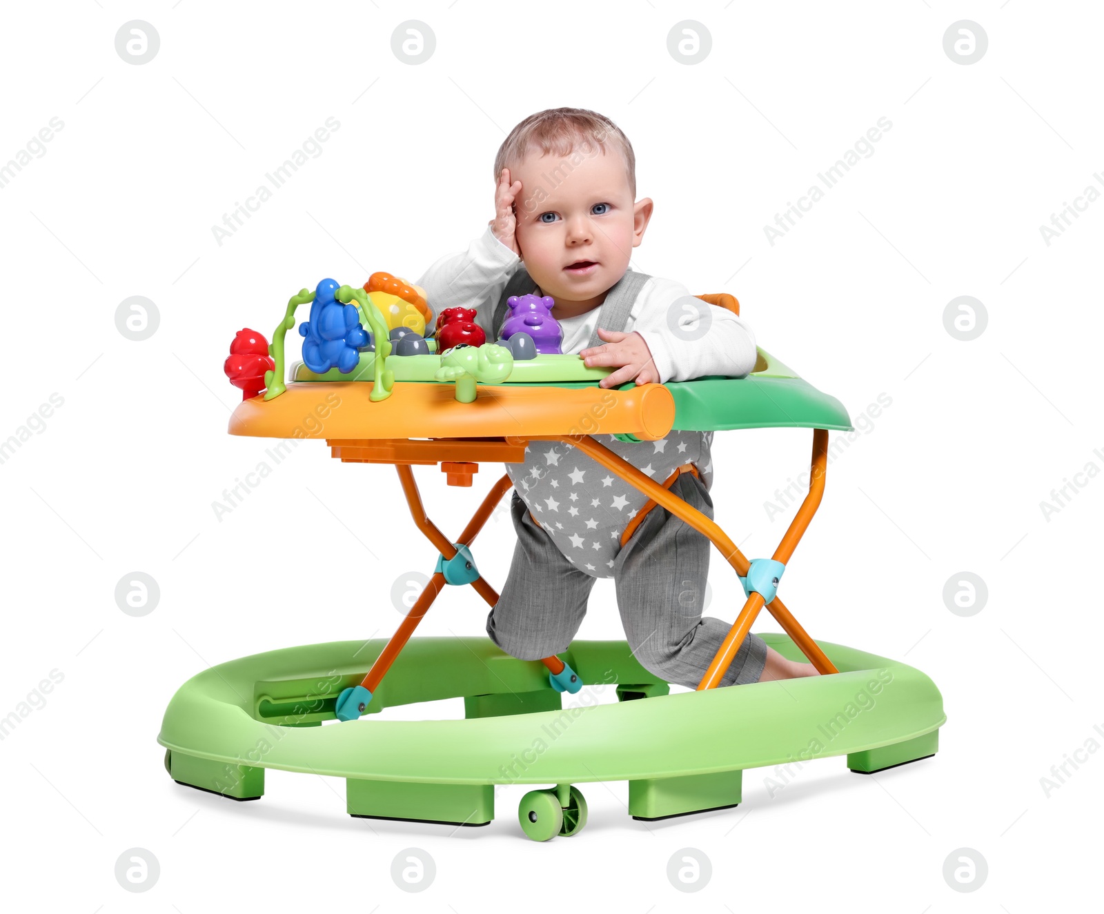 Photo of Portrait of cute little boy in baby walker on white background