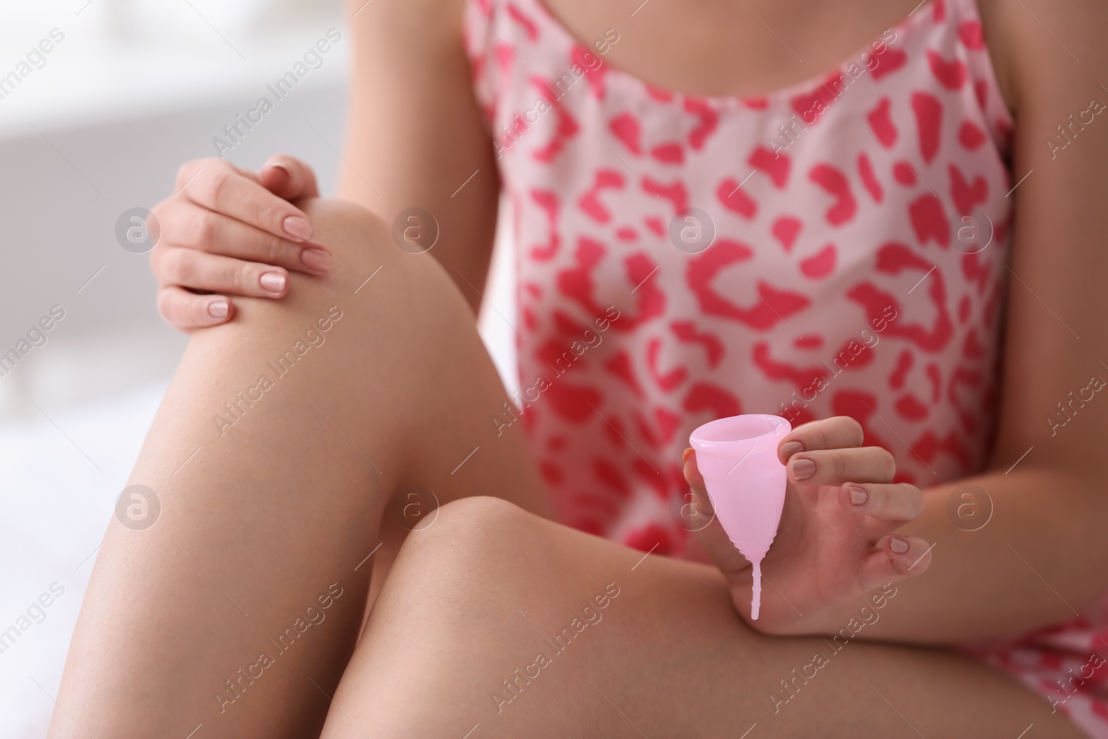 Photo of Young woman with menstrual cup, closeup. Gynecology