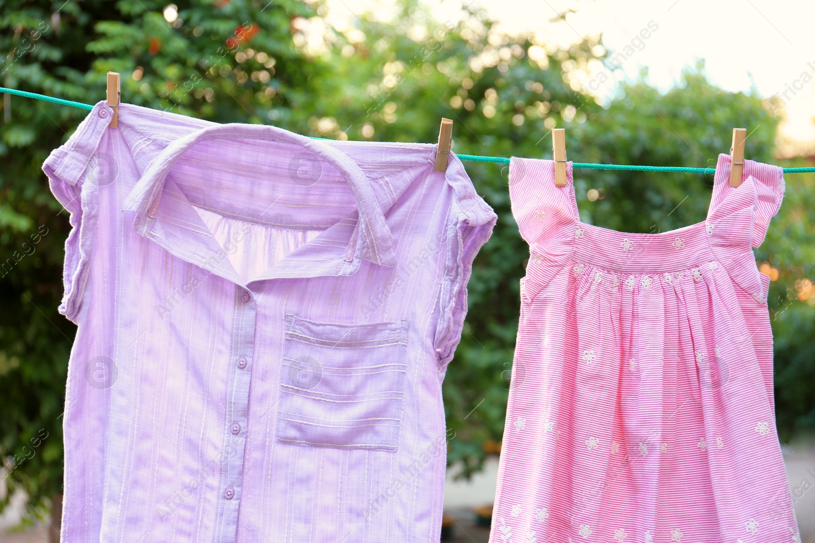 Photo of Clothes on laundry line outdoors on sunny day