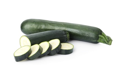 Photo of Cut and whole green ripe zucchini isolated on white
