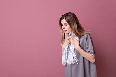 Photo of Woman coughing on color background