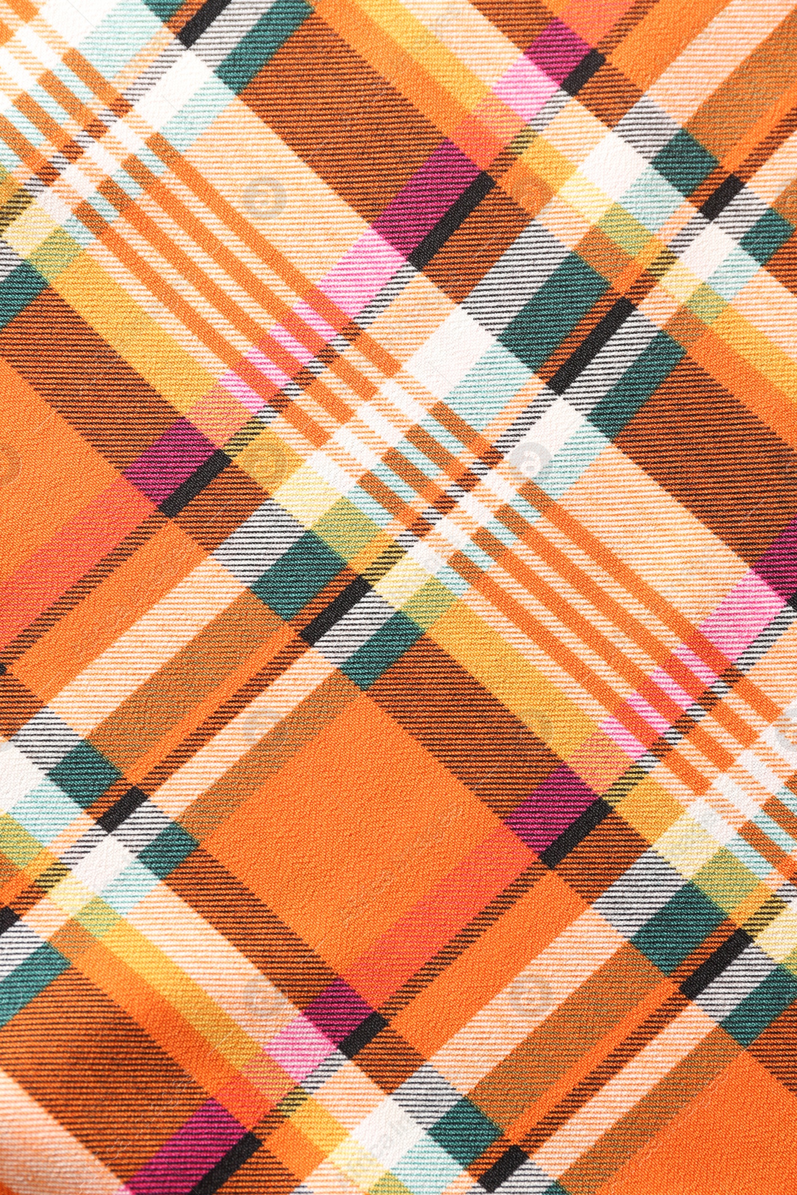 Photo of Checkered fabric with orange color as background, top view