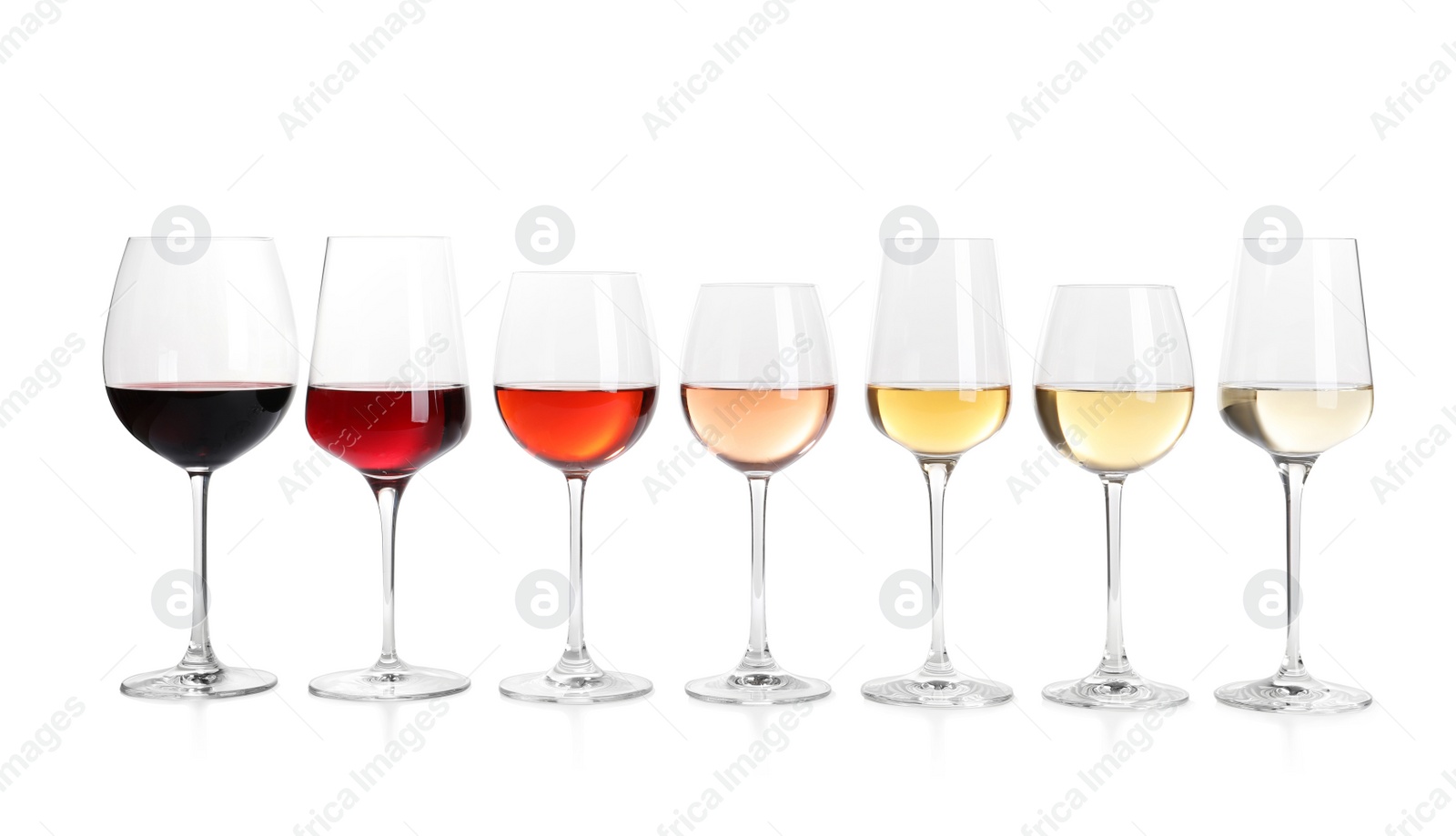 Photo of Row of glasses with different wines on white background