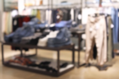 Blurred view of modern store with different clothes