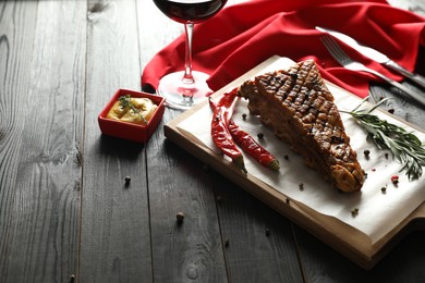 Delicious roasted ribs served on wooden table