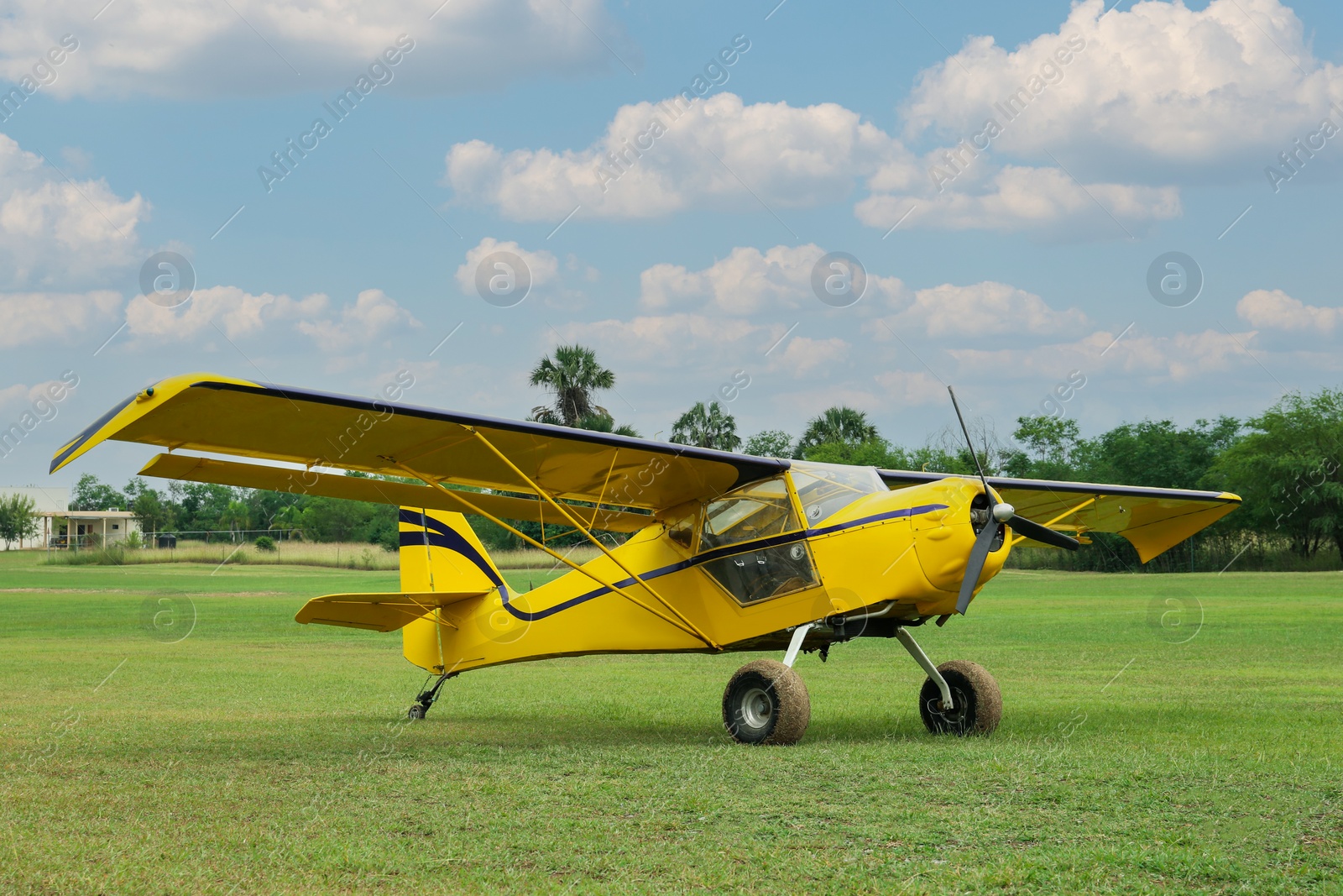 Photo of View of beautiful ultralight airplane in field on autumn day