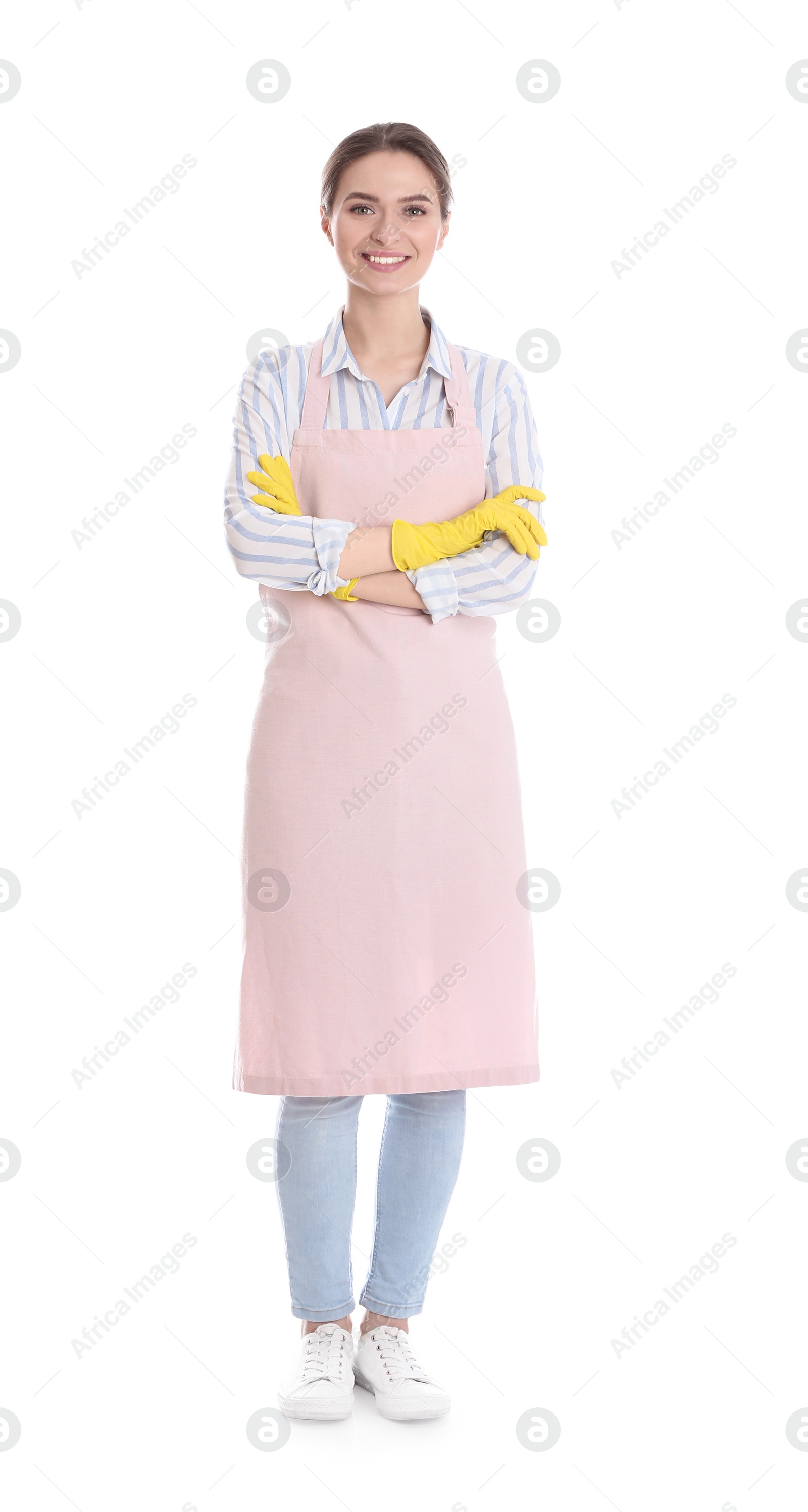 Photo of Young chambermaid wearing gloves on white background