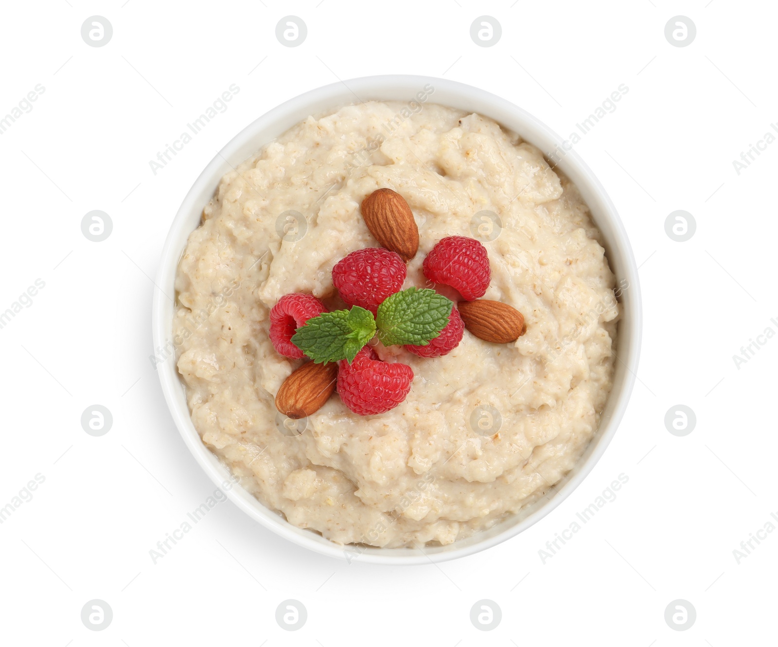 Photo of Tasty oatmeal porridge with raspberries and almond nuts in bowl on white background, top view