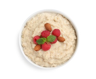Photo of Tasty oatmeal porridge with raspberries and almond nuts in bowl on white background, top view