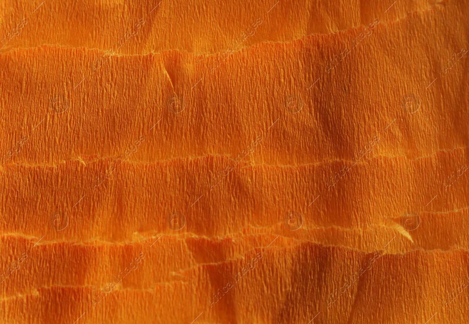 Photo of Orange textured material as background, closeup view