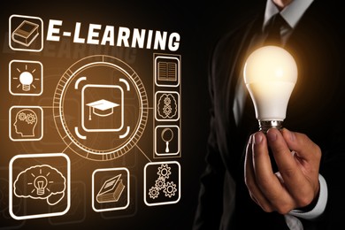 Image of E-learning. Man holding lamp bulb on black background, closeup. Illustration of scheme with different icons