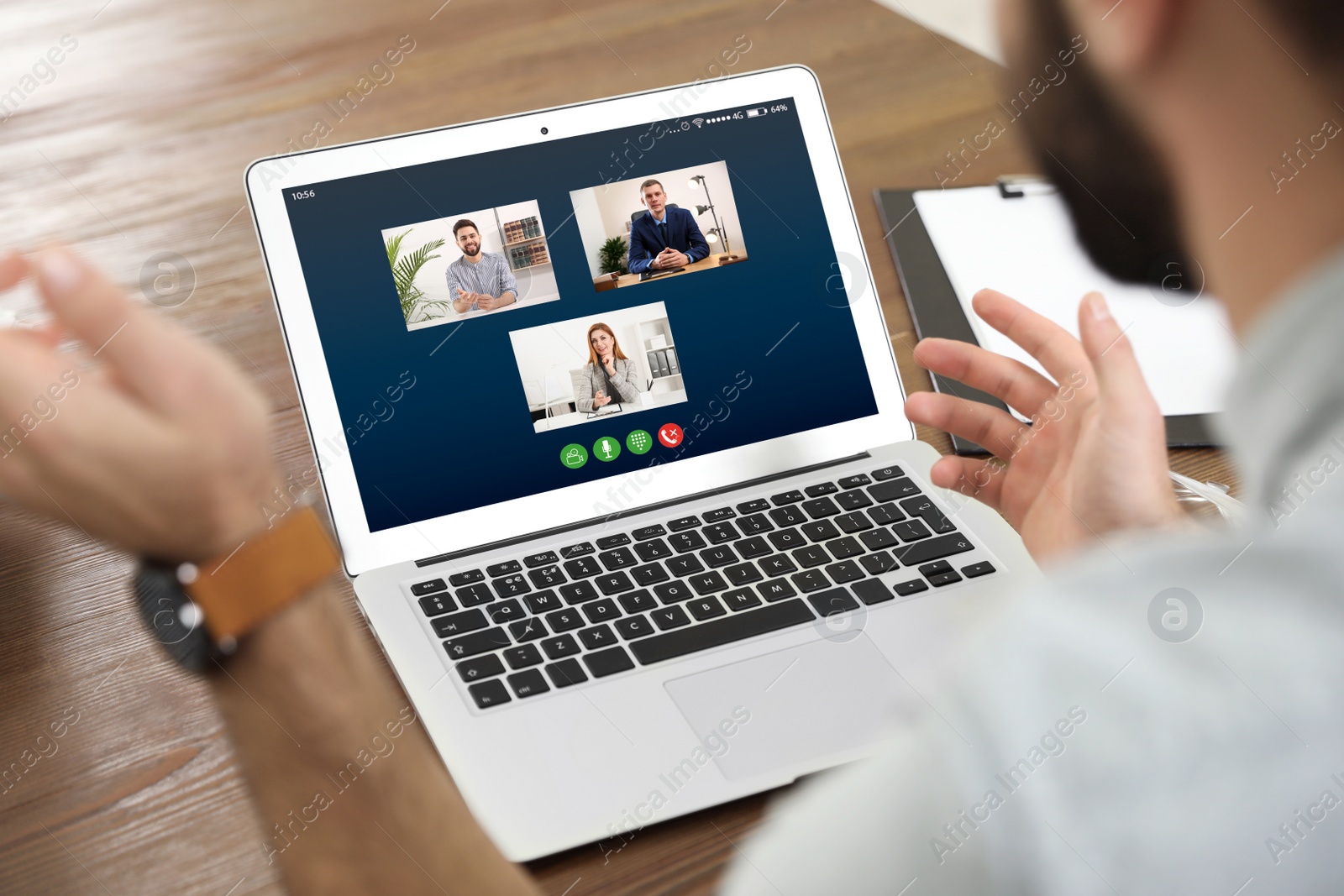 Image of Man having online meeting with his team via laptop, closeup