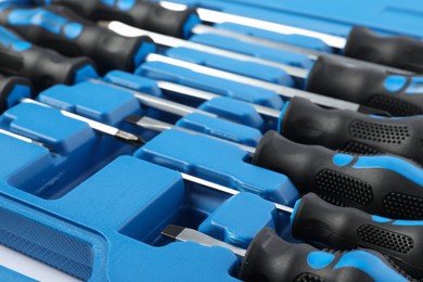 Photo of Set of screwdrivers in toolbox as background, closeup